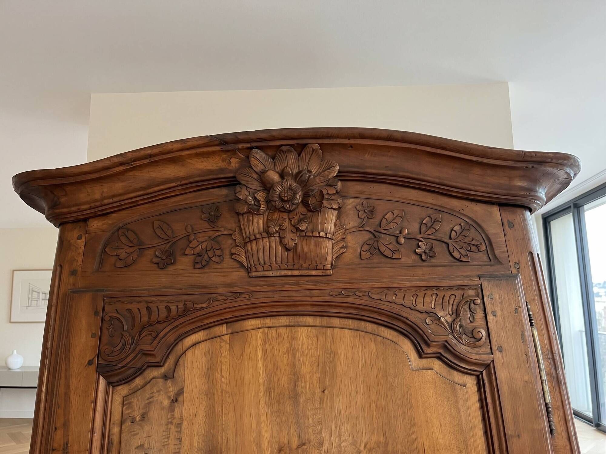 Antique carved wooden wardrobe with cornice.