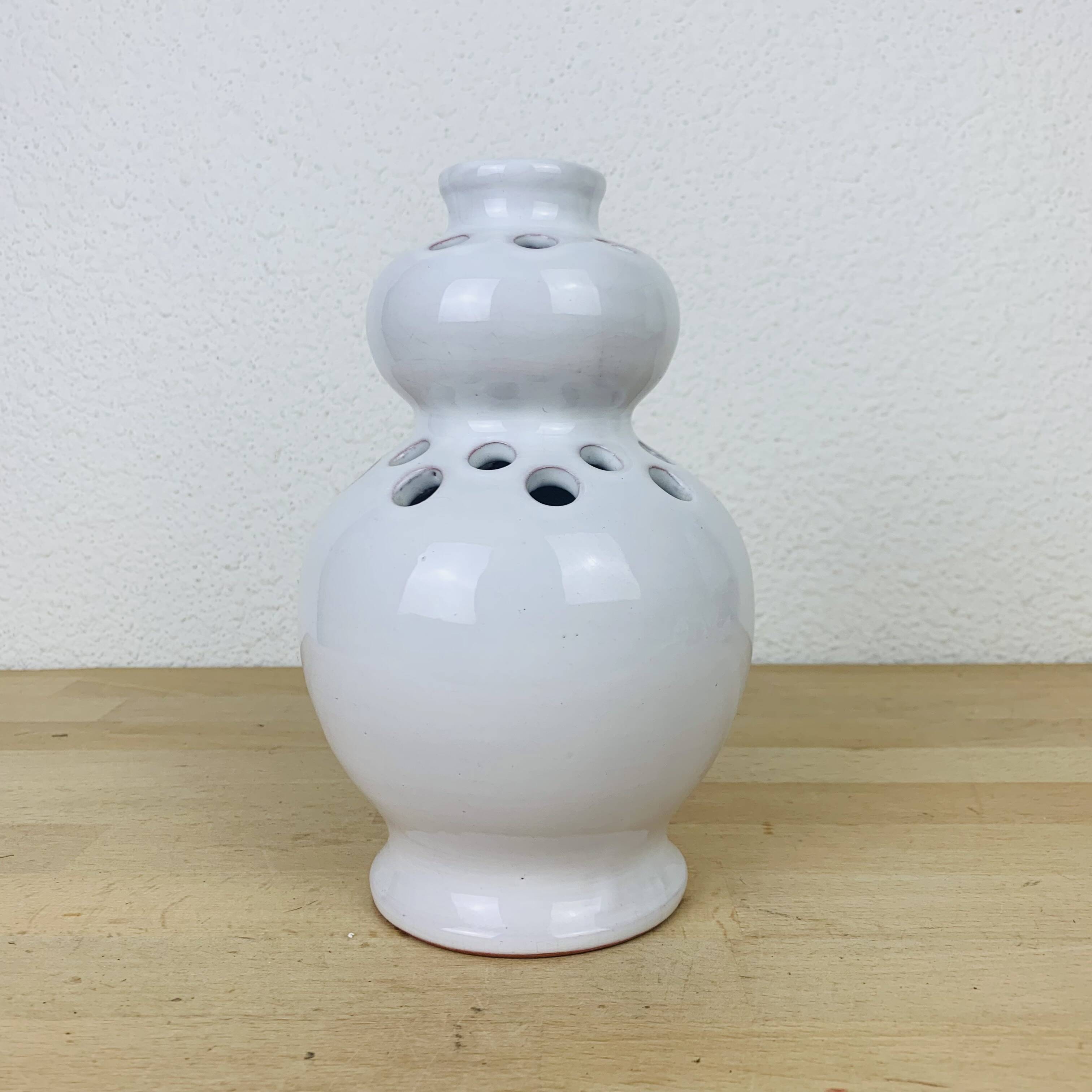 Vase with white ceramic flowers