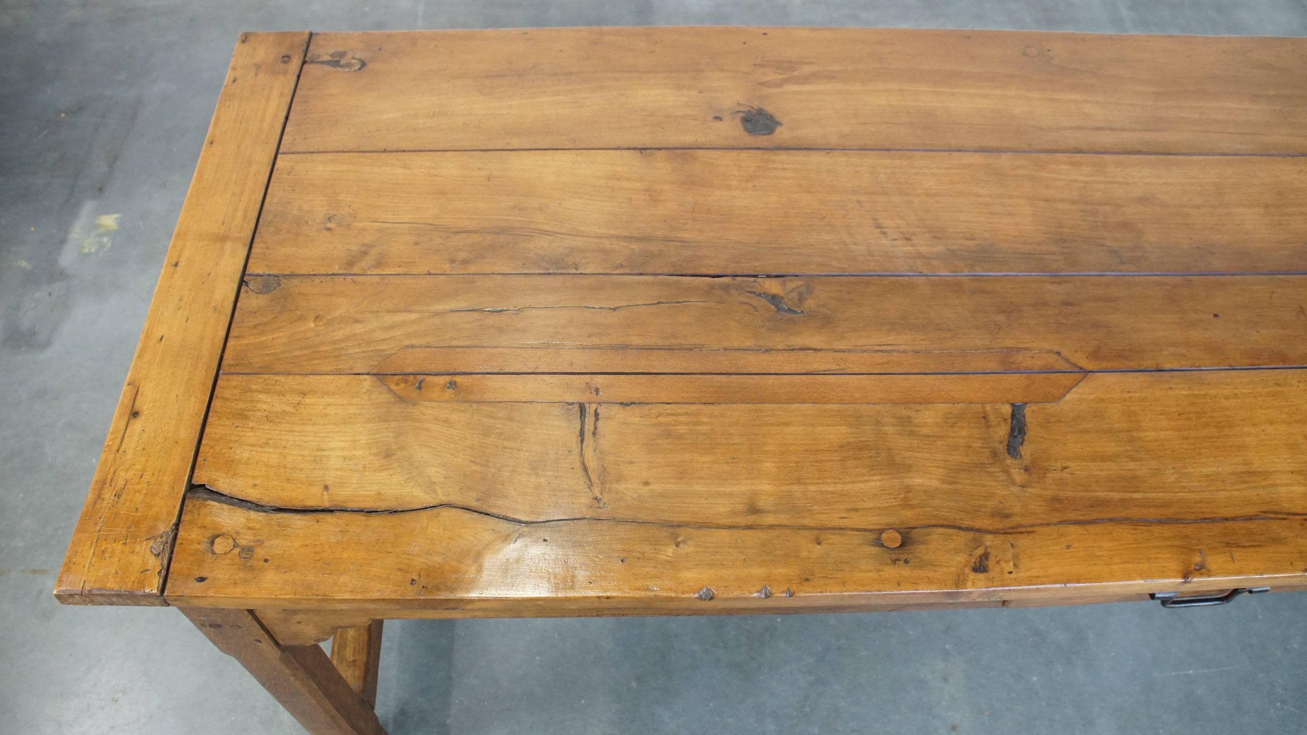 Antique French farmhouse dining table of fruitwood from the 18th century