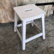 Vintage white wood milking stool