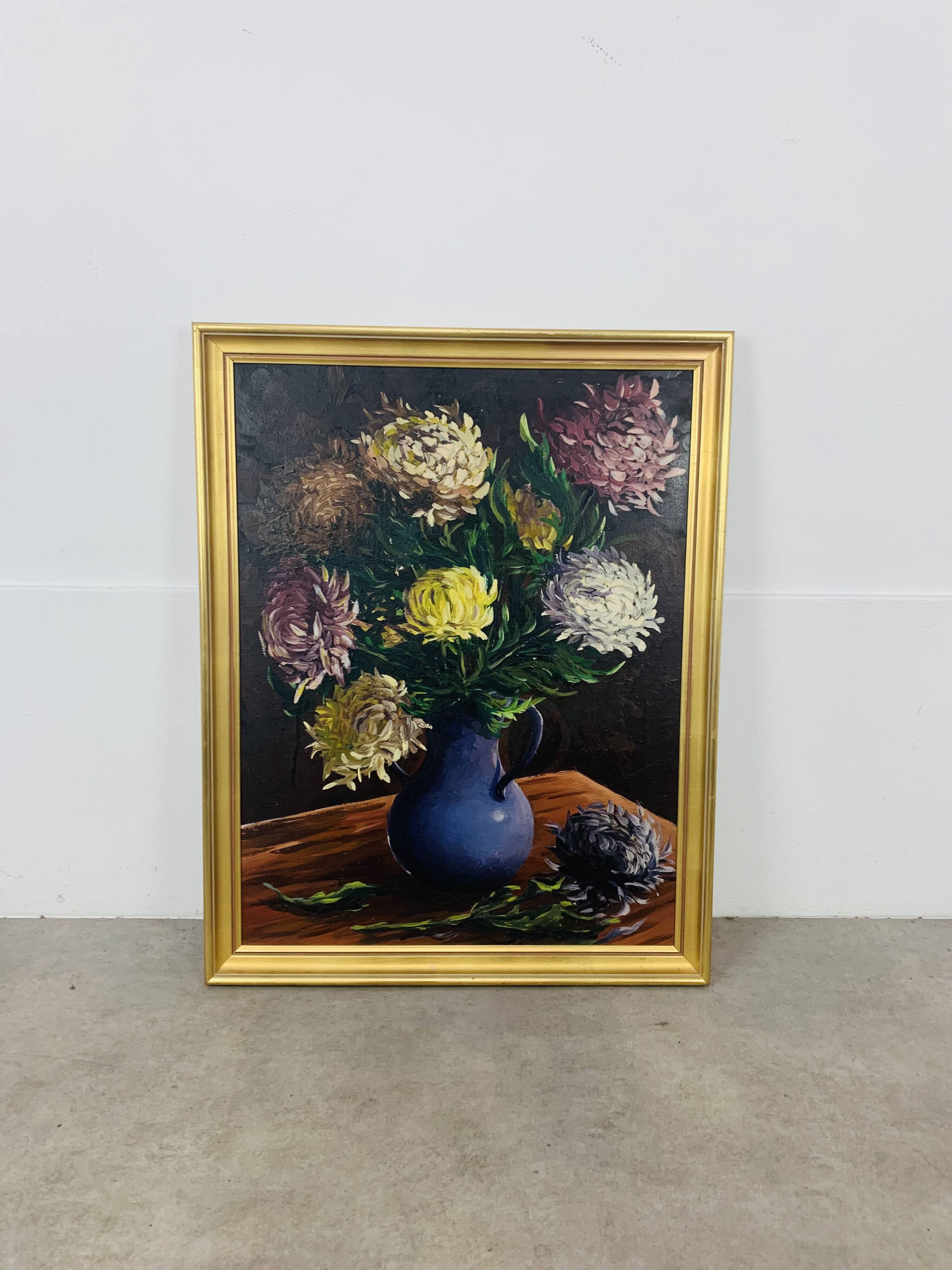 Still life painting of a bouquet of flowers, golden frame