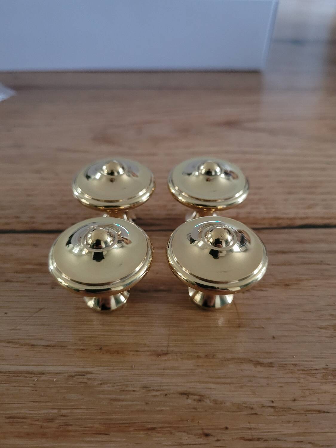 Polished brass furniture knobs