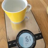 4 yellow and white cups and saucers