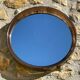 Vintage round smoked plastic mirror, circa 1970s.