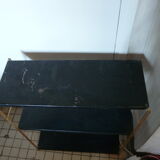 String shelf in gold and black metal