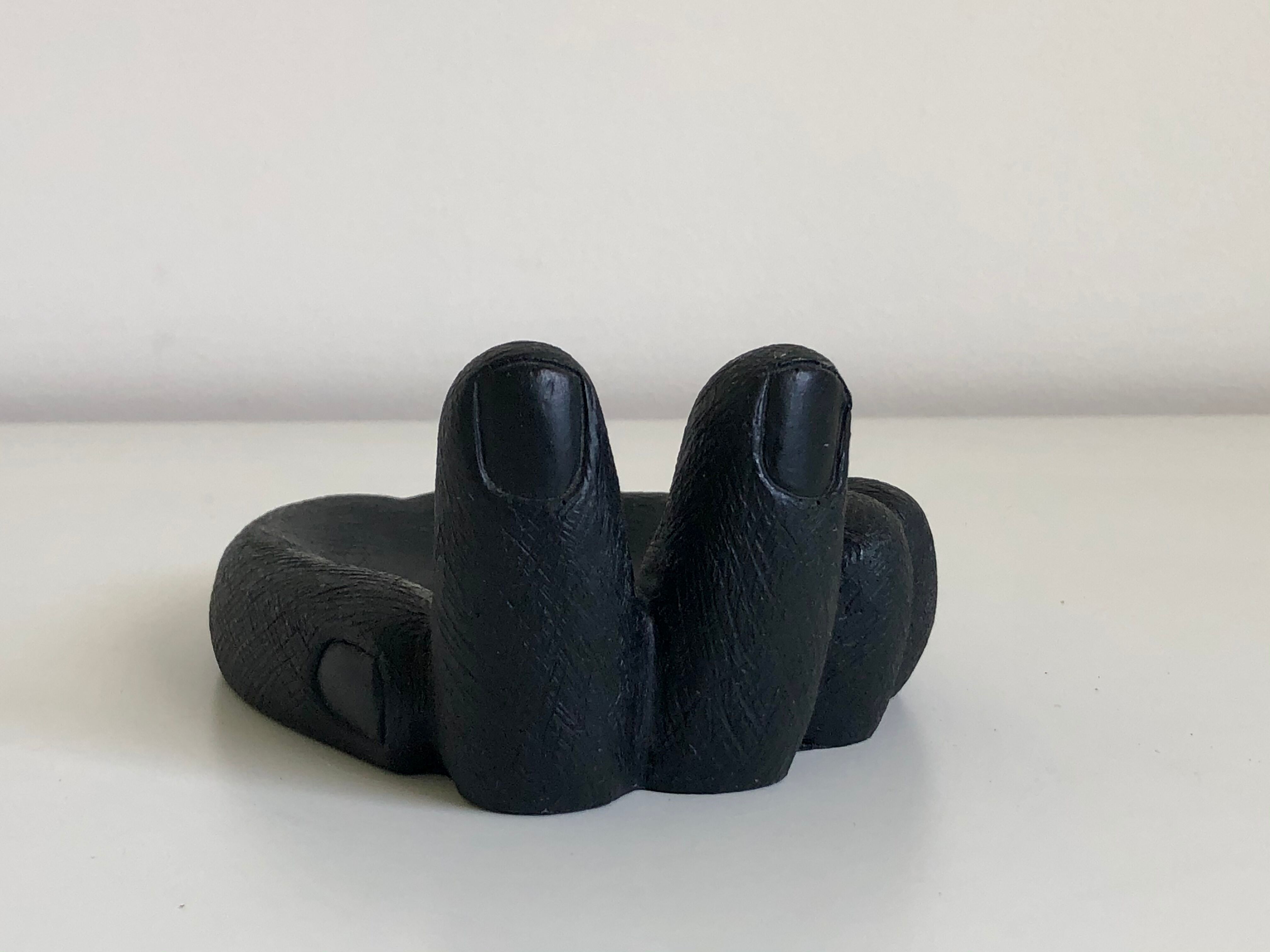 Empty pocket in Hawaiian lava in the shape of a hand signed Coco Joe, 1960