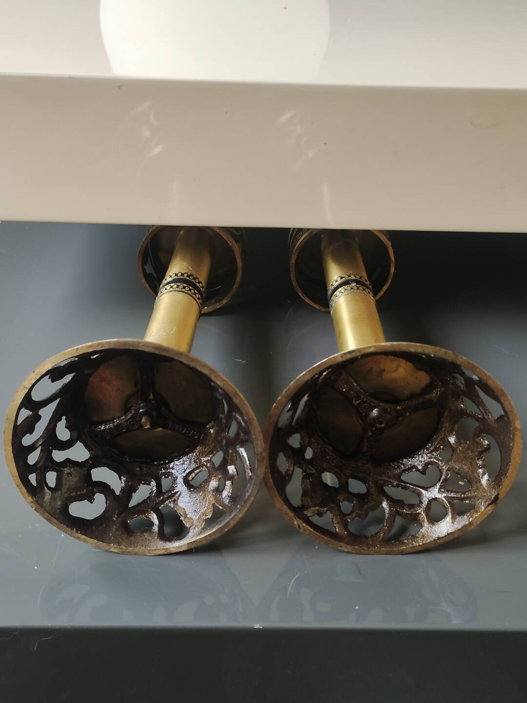 Pair of Hebrew Candlesticks. In antique gold-plated brass. Signed FFS Israel