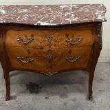 Curved and inlaid Louis XV style chest of drawers