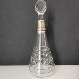 Crystal bottle with silver metal neck rim
