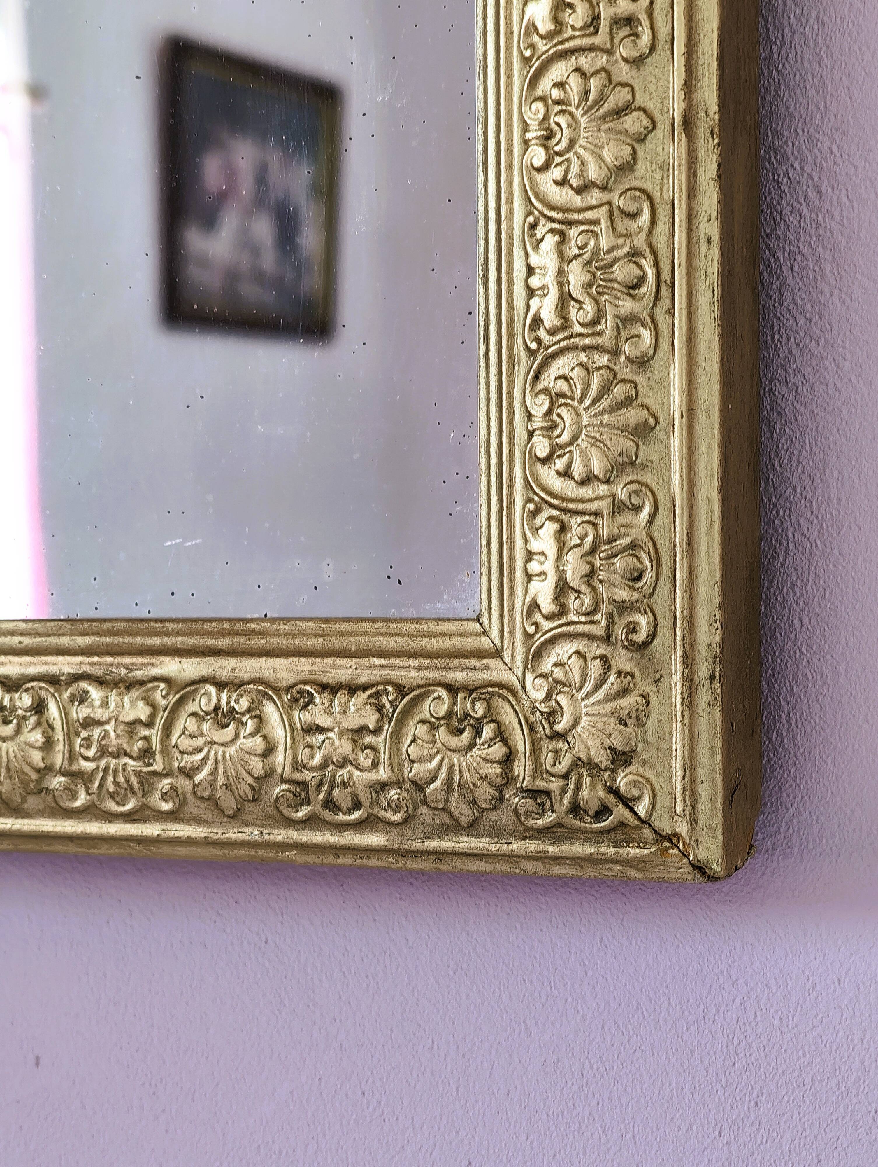 Rectangular wooden mirror with ornate Art Nouveau gold finish.