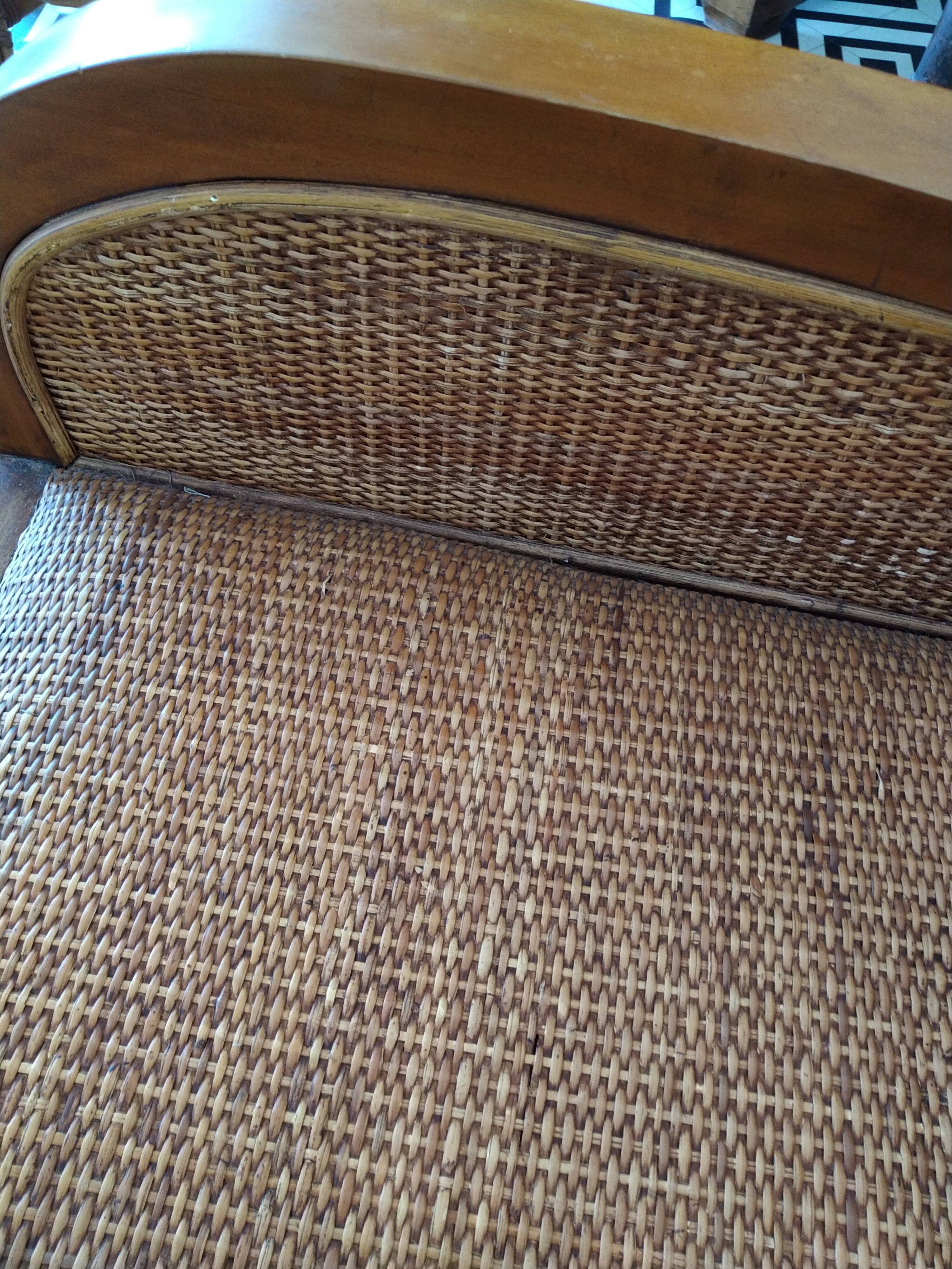 Colonial rattan armchair with ottoman