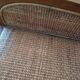 Colonial rattan armchair with ottoman