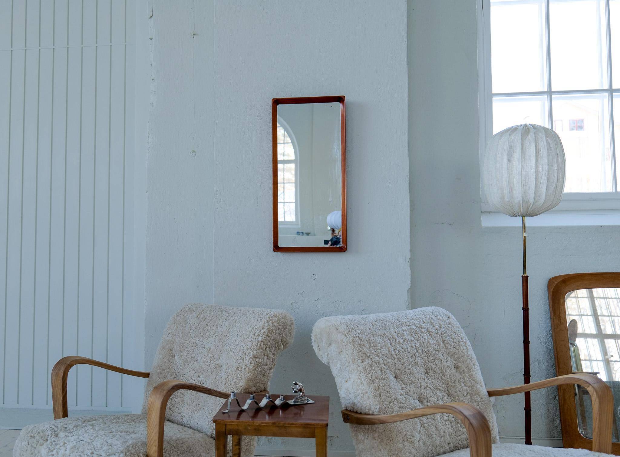 Modern Swedish mirror in mahogany from the 1940s.