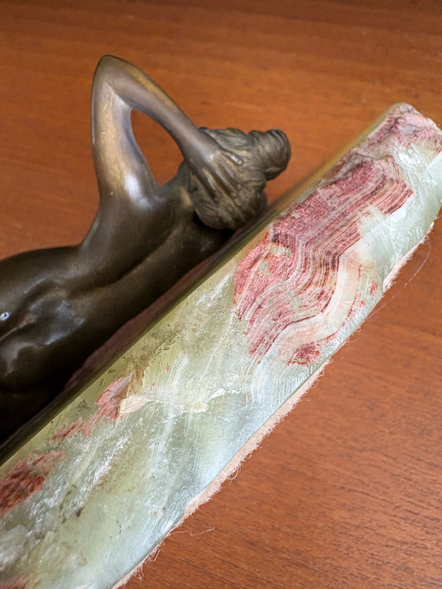 Art Deco female sculpture in bronze with onyx base.