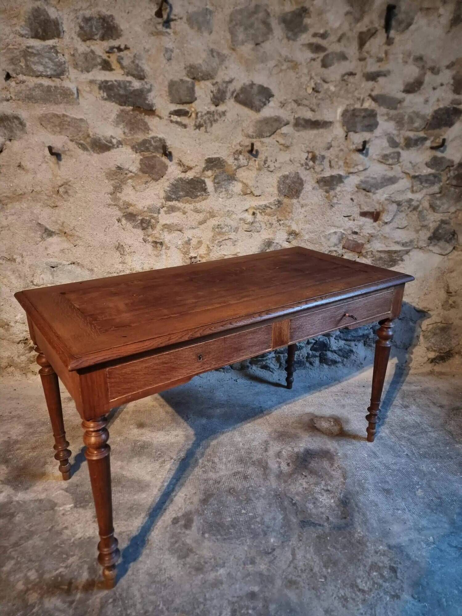 Antique French writing desk in oak with two drawers, 1920s.