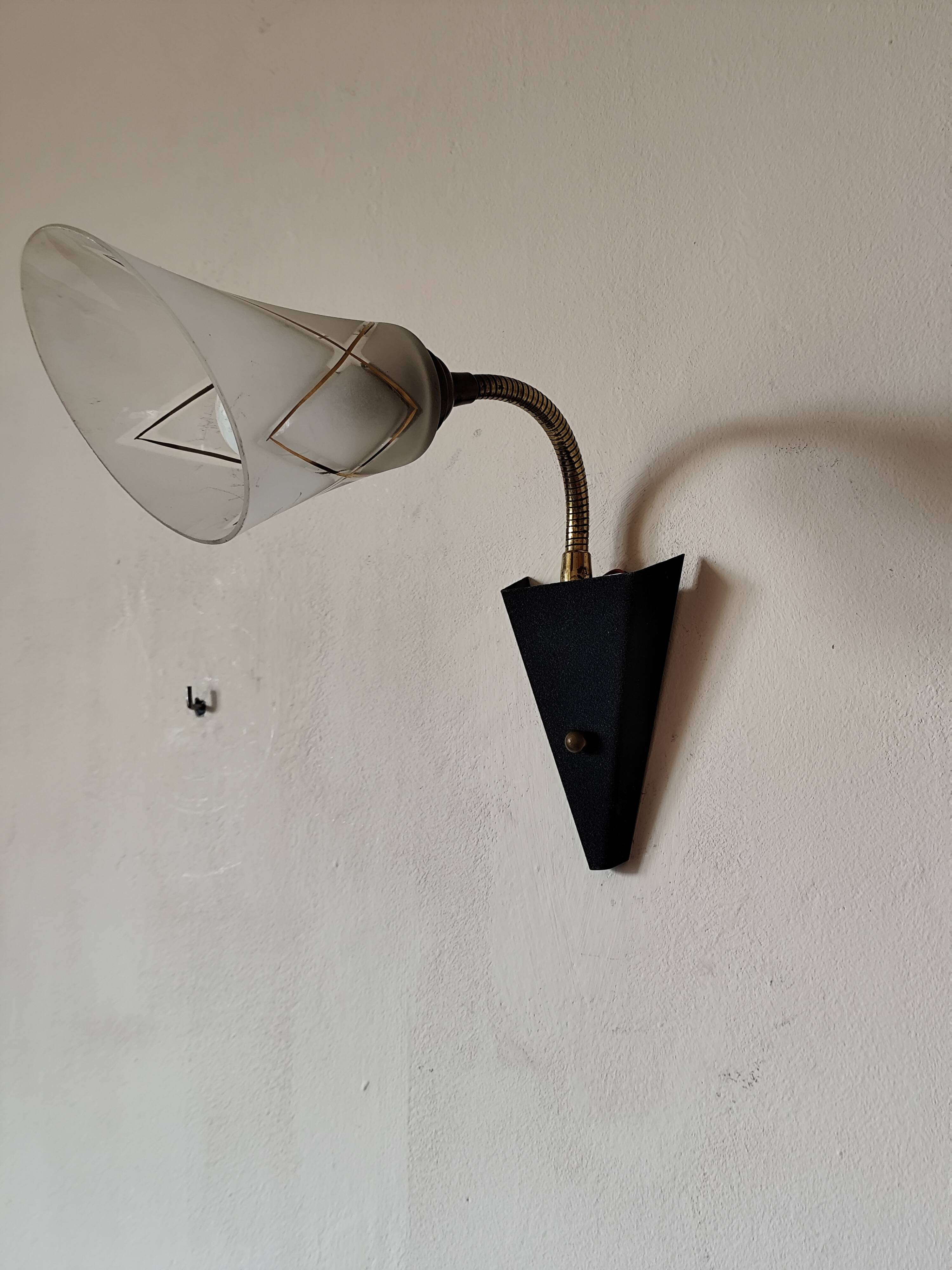 1950s wall lamp, metal, flexible brass stem and opaque shade.