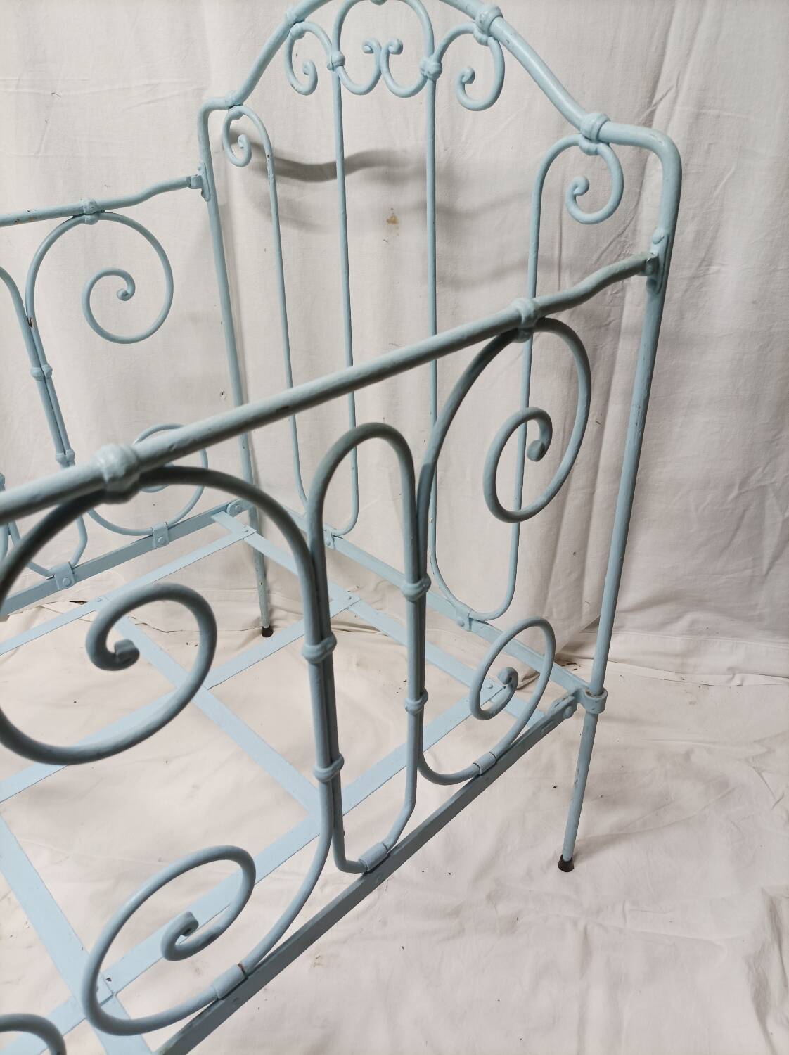 Old children's bed with metal bars