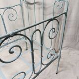 Old children's bed with metal bars