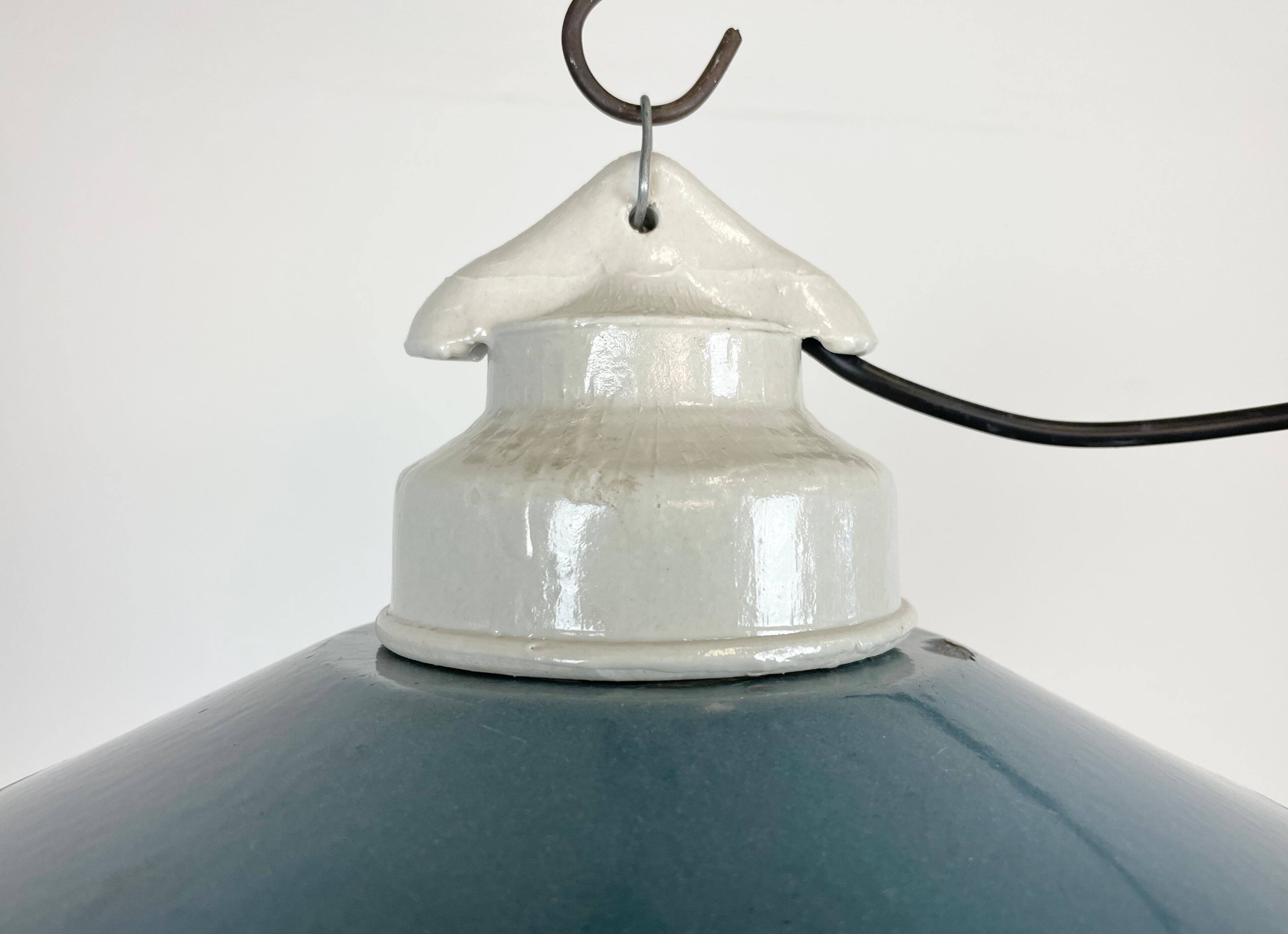 Industrial porcelain blue enamel pendant light with ribbed clear glass, 1970s