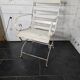 Old wrought iron and wood garden armchair