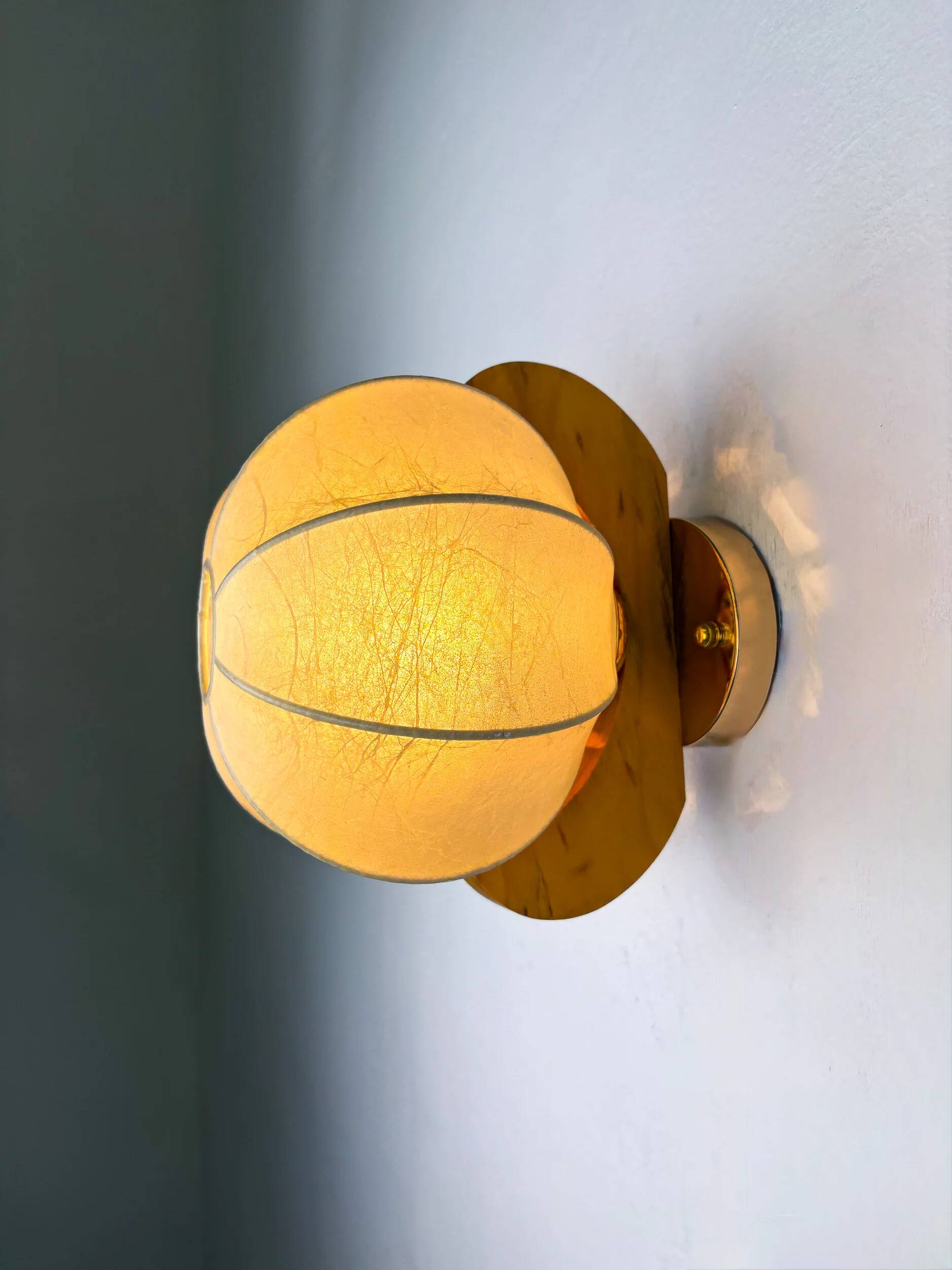 Pair of "Cocoon" wall lights in resin and pine, Italy, circa 1970