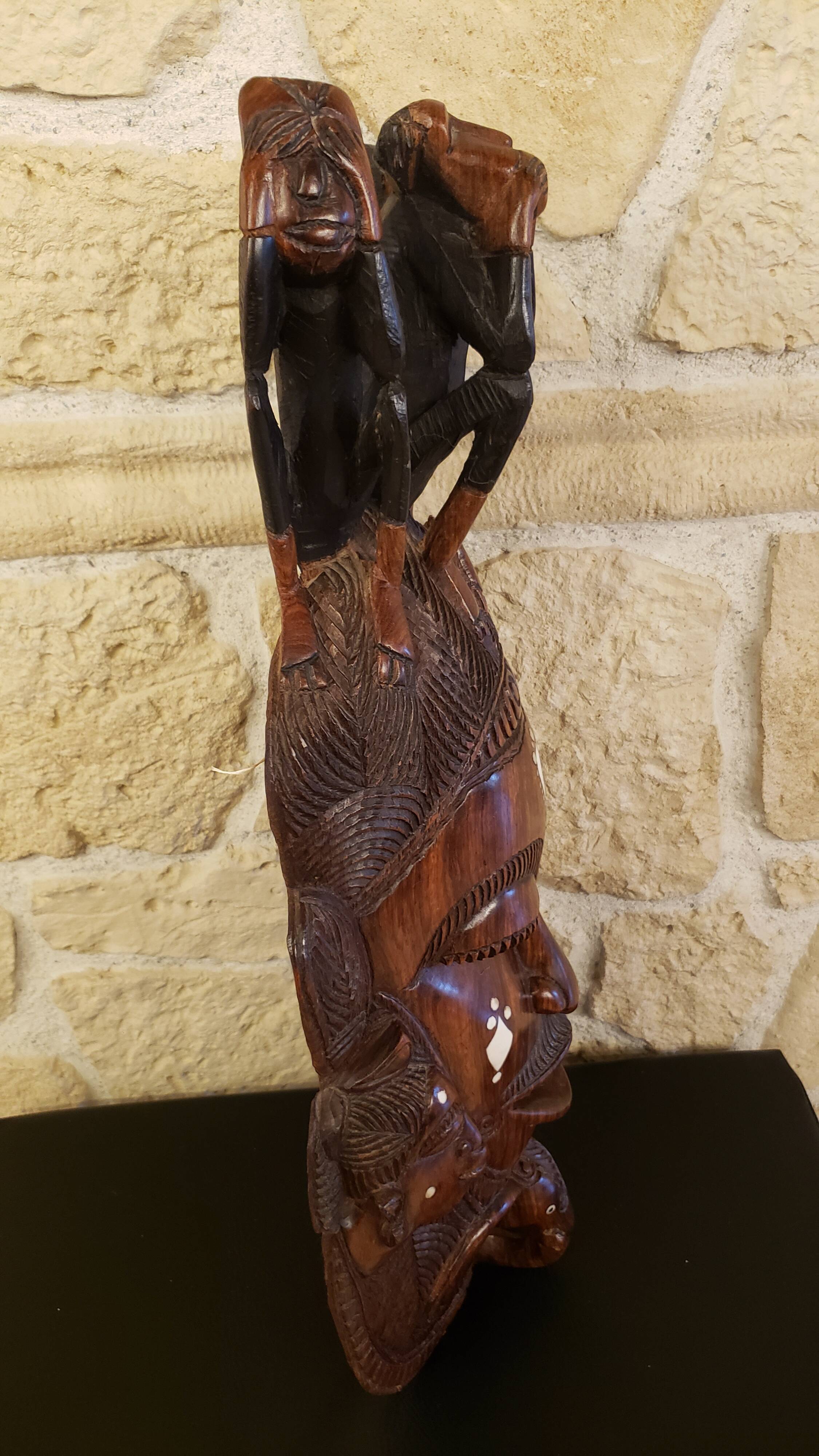 Old large African wall mask in carved wood