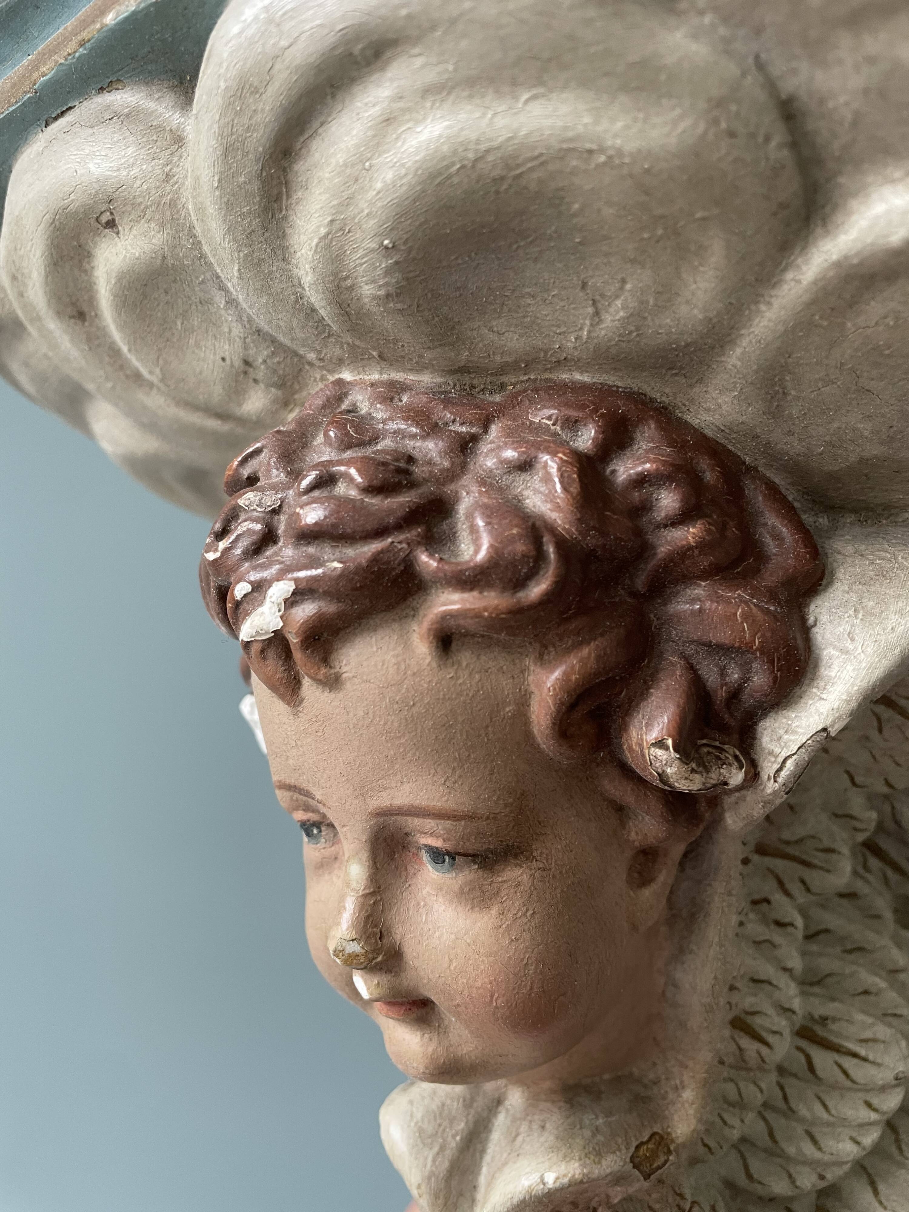 Nineteenth century plaster wall console, cherub decoration