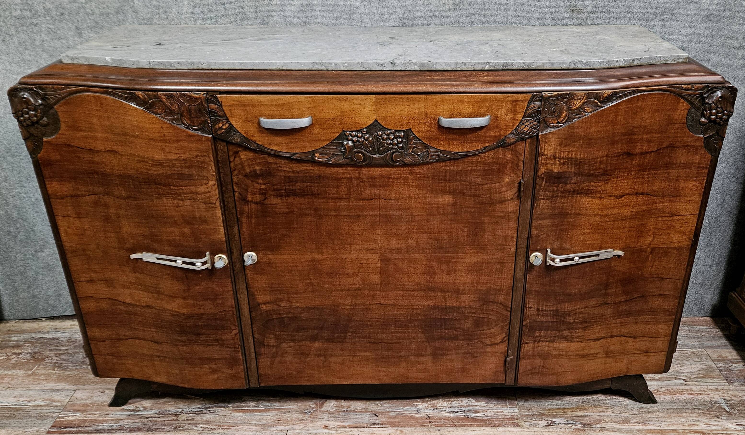 Sideboard in a row, Art Deco period, in mahogany.