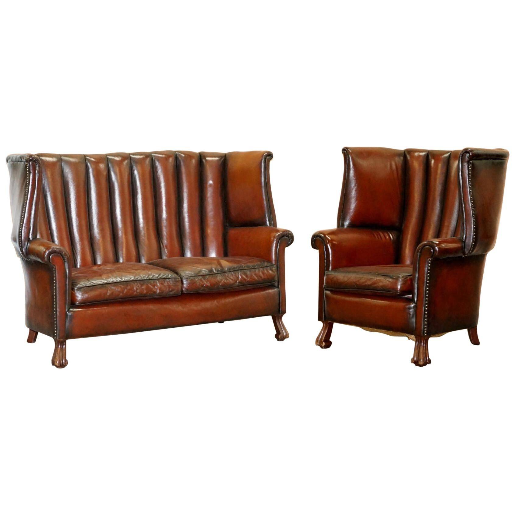 Victorian leather canapé and armchair, barrel back, circa 1860, restored.