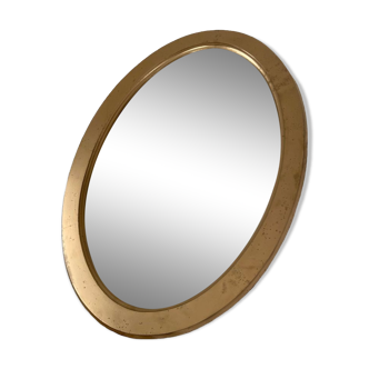 Golden oval mirror