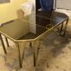 Coffee table in solid brass and black opaline. 1970
