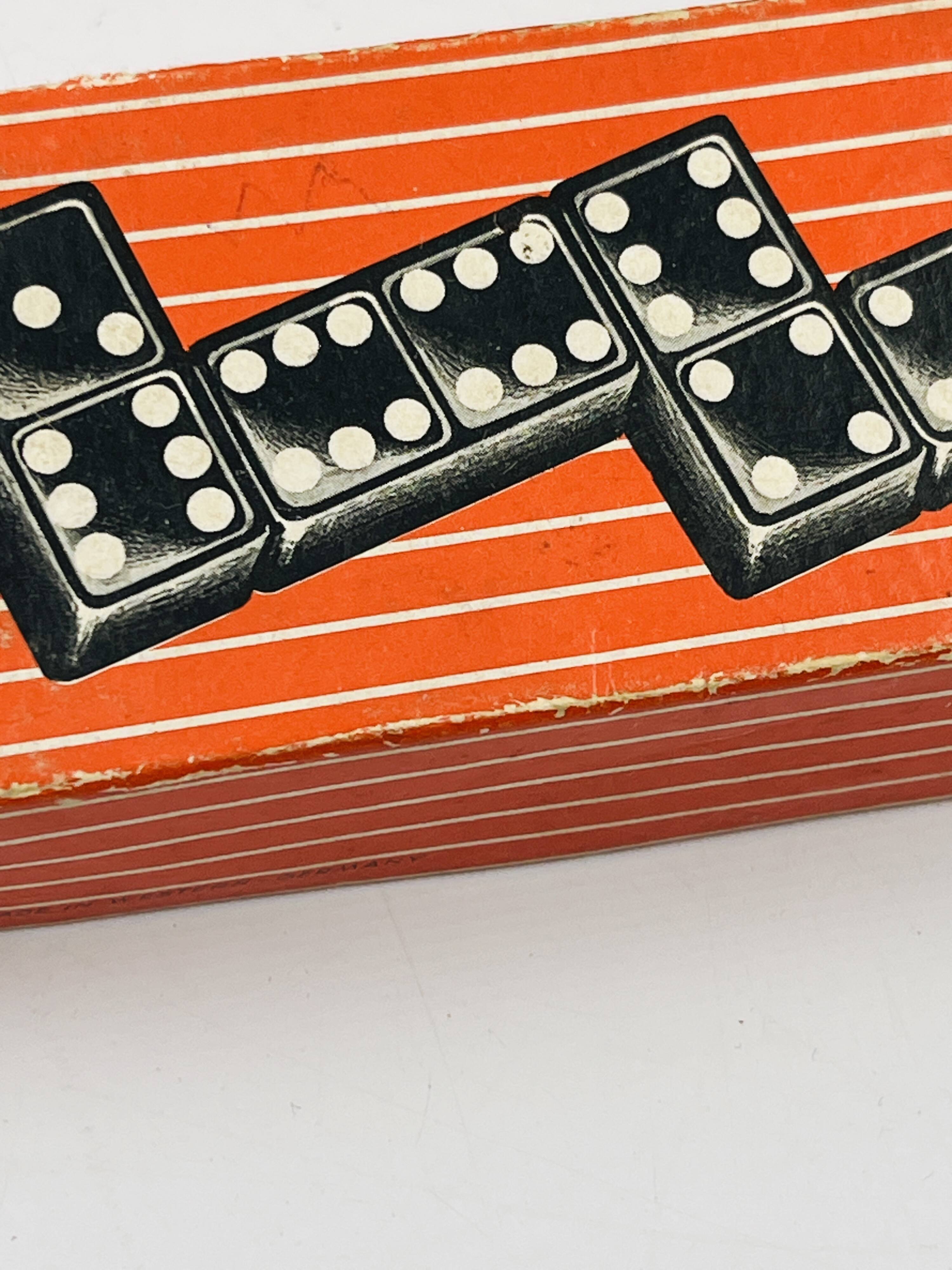 Complete vintage domino set with original box.
