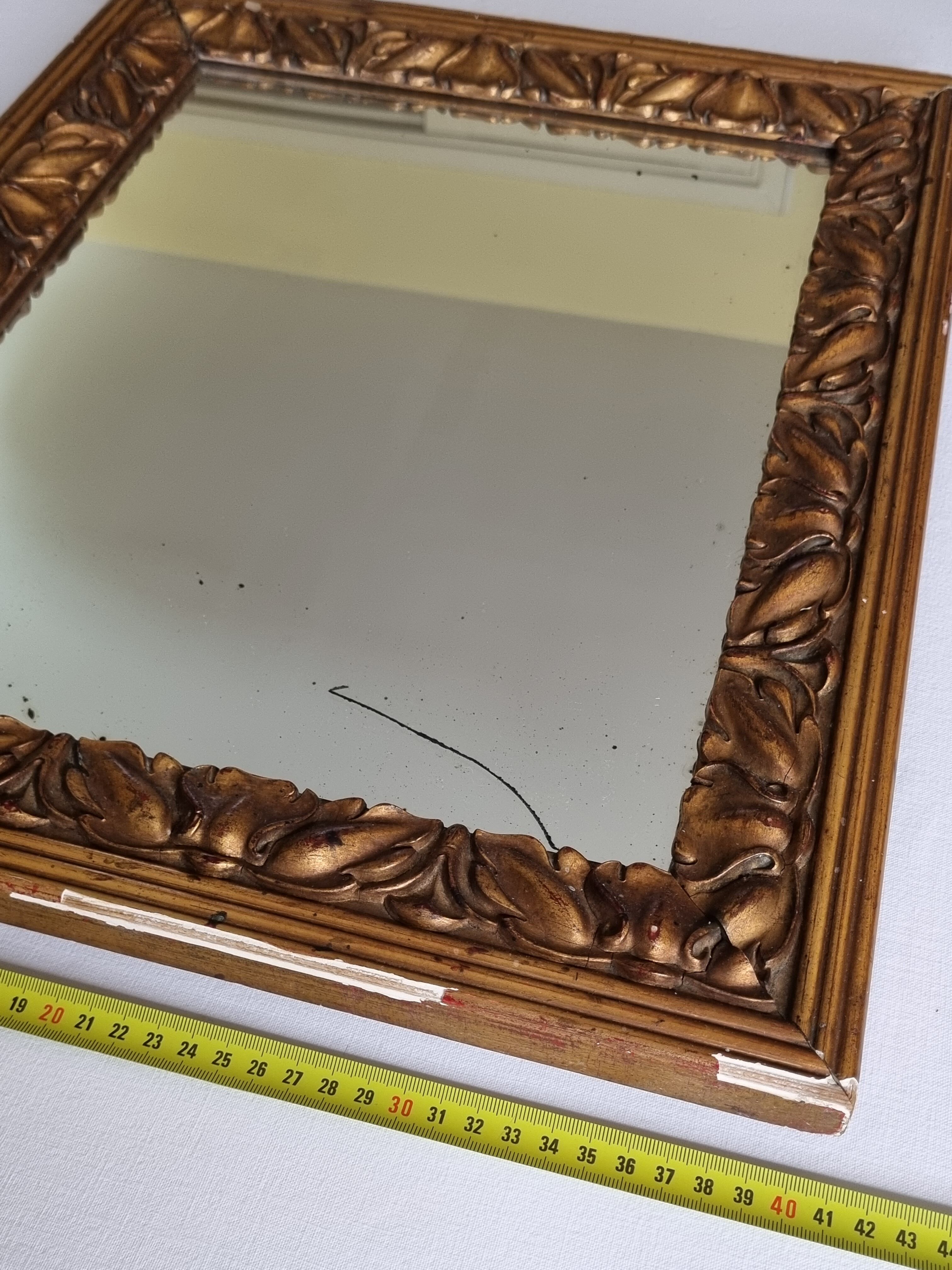 Patinated golden rectangular mirror, decorated with acanthus leaves, 49 cm