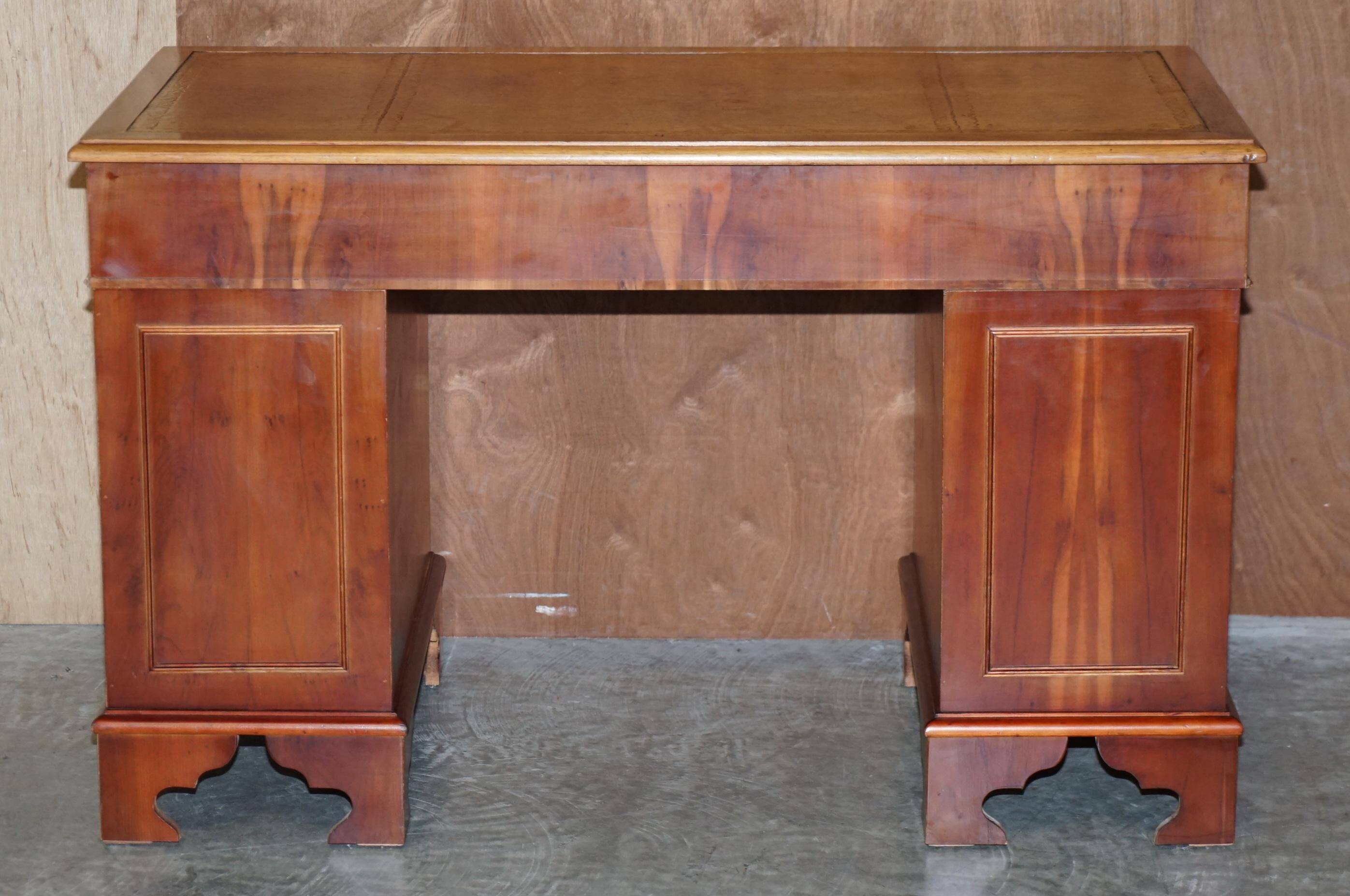 Vintage walnut desk with a leather top and two drawers.