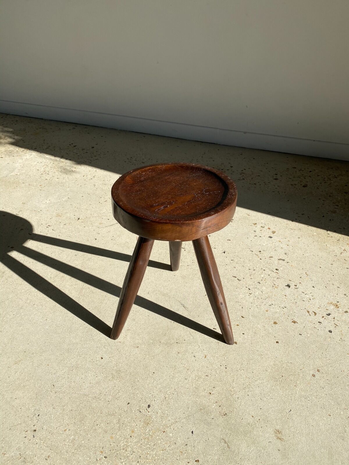 Brown solid wood stool seated circular dug