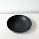 Round vintage black ceramic catchall.