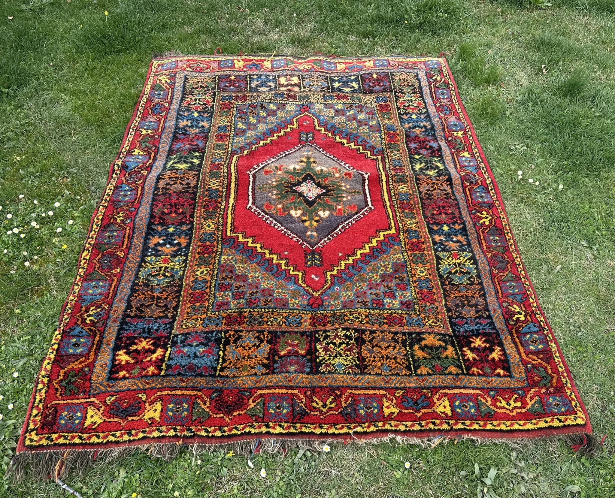 Old Moroccan carpet, made of natural wool and handwoven.