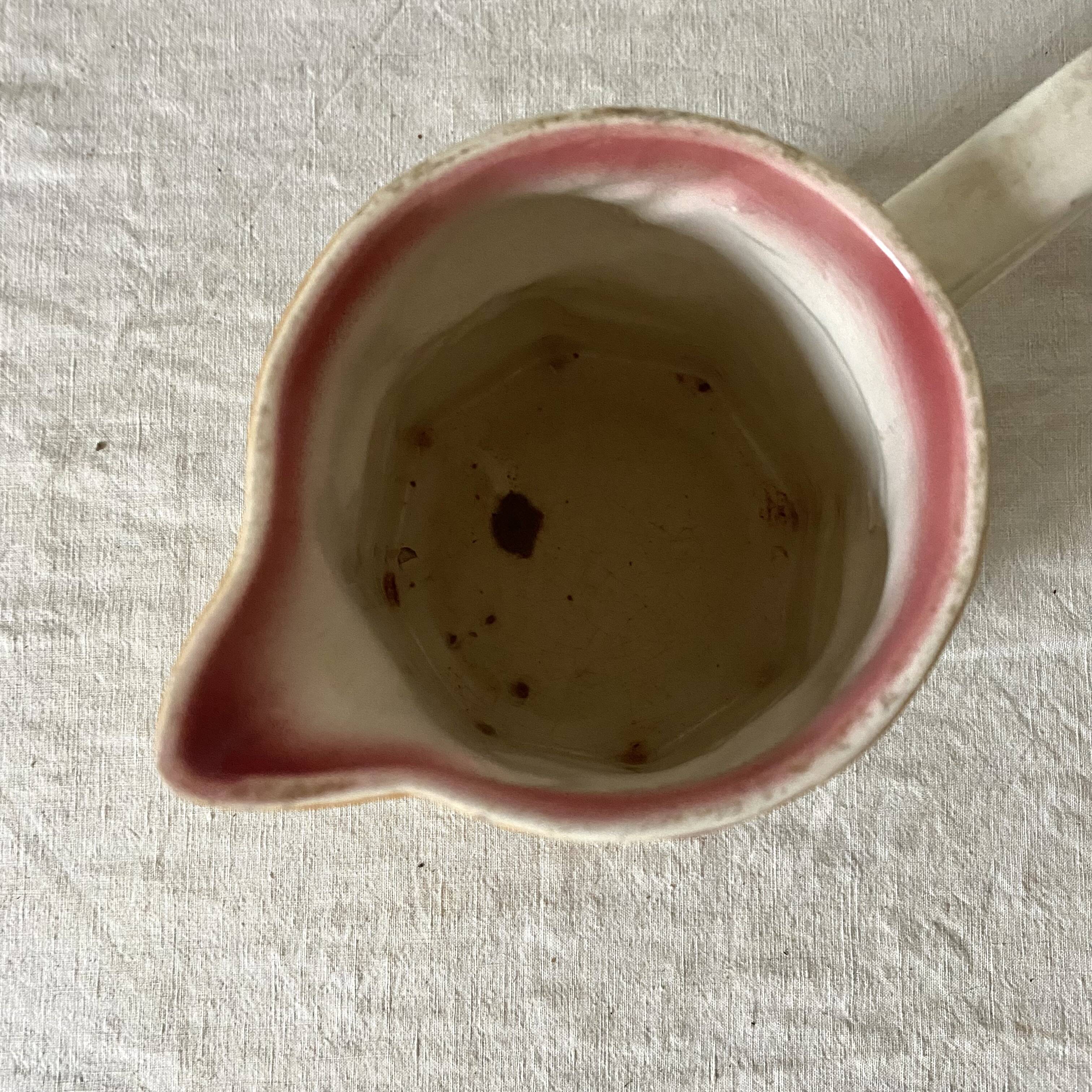 Antique pitcher in Apple slip