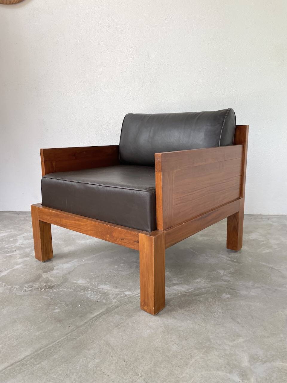 Modernist armchair in exotic wood and leather