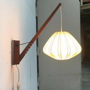 Mid-century pivoting wall lamp with a swing arm, Cocoon, made of teak wood, 1960s.