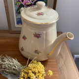 Old teapot or coffee maker in English style.