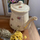 Old teapot or coffee maker in English style.