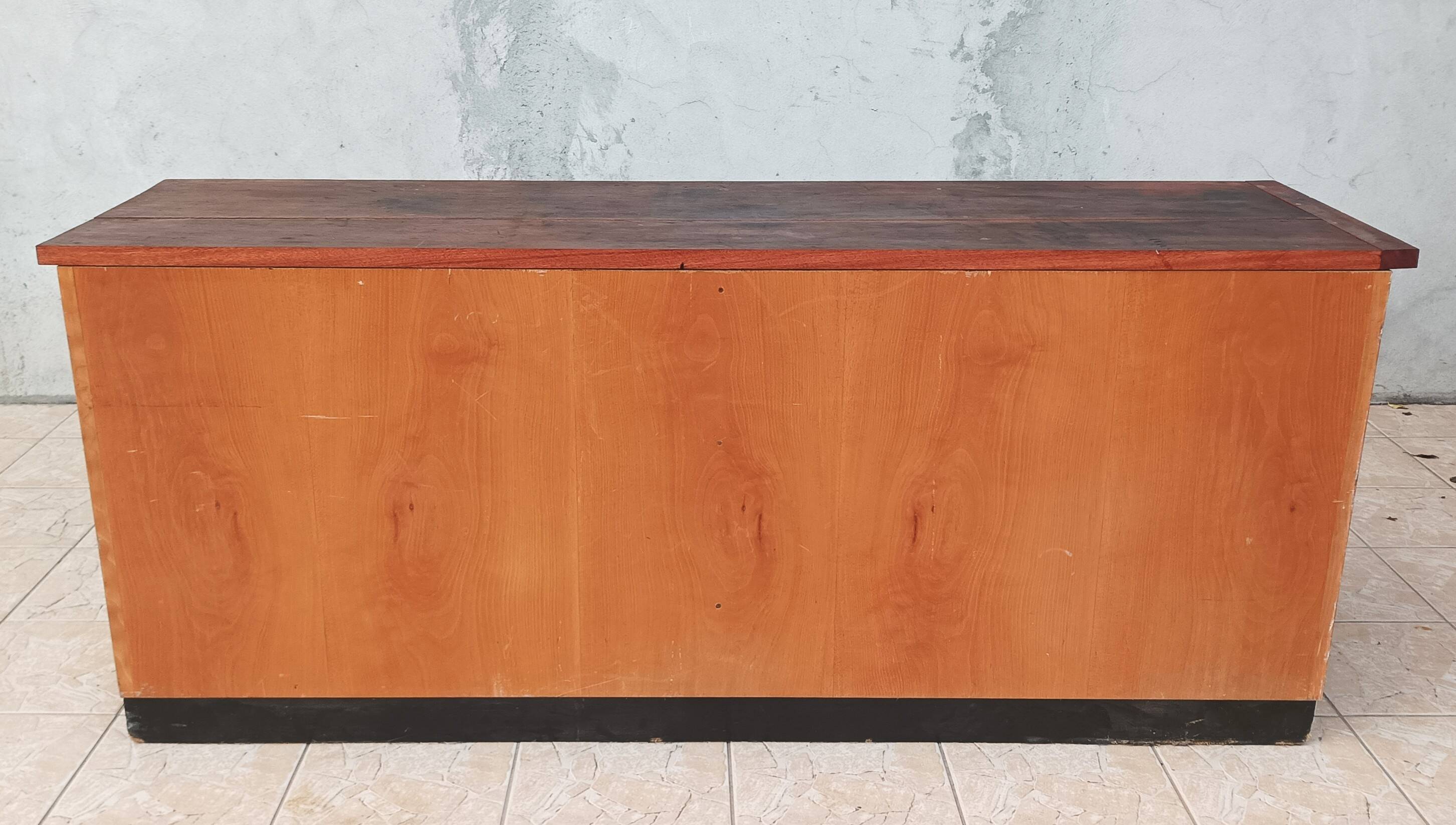 Workshop furniture with drawers and curtain in beech and walnut.