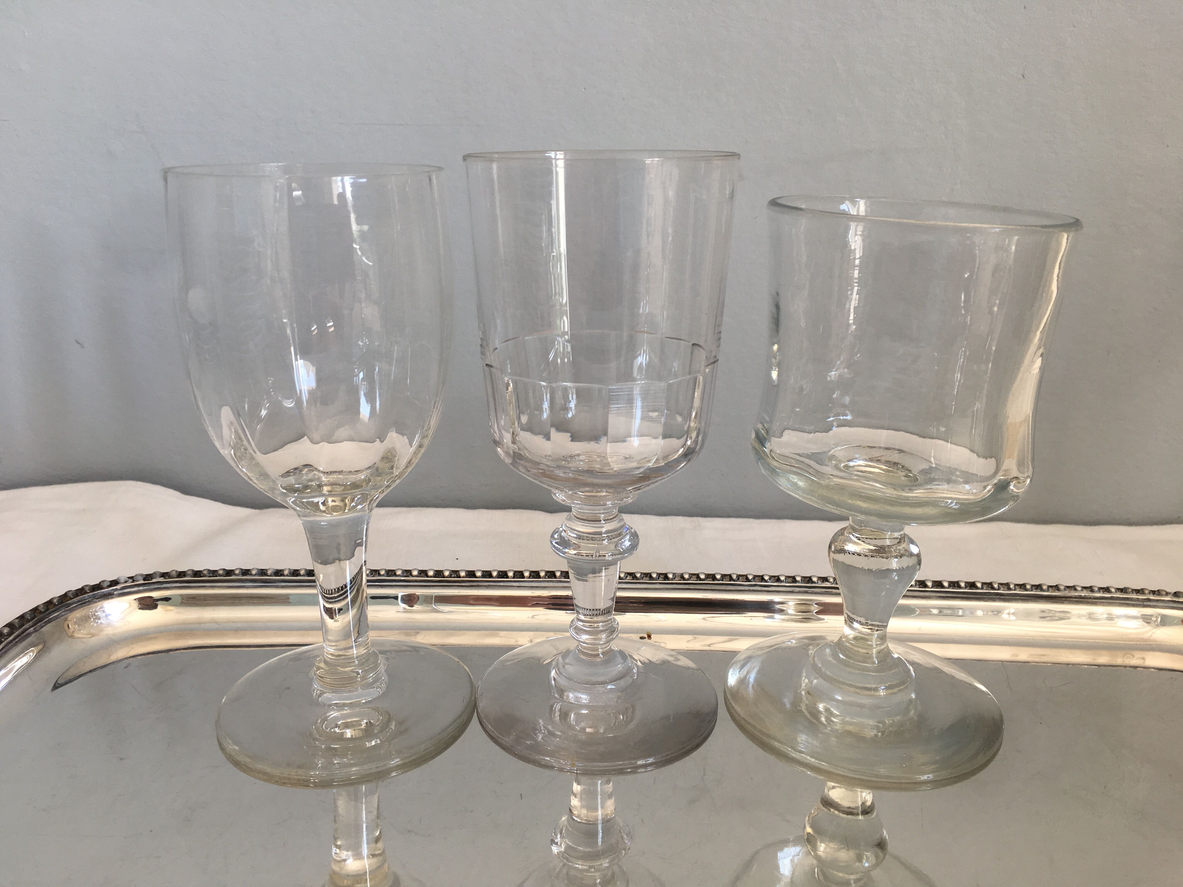 6 old mismatched water glasses