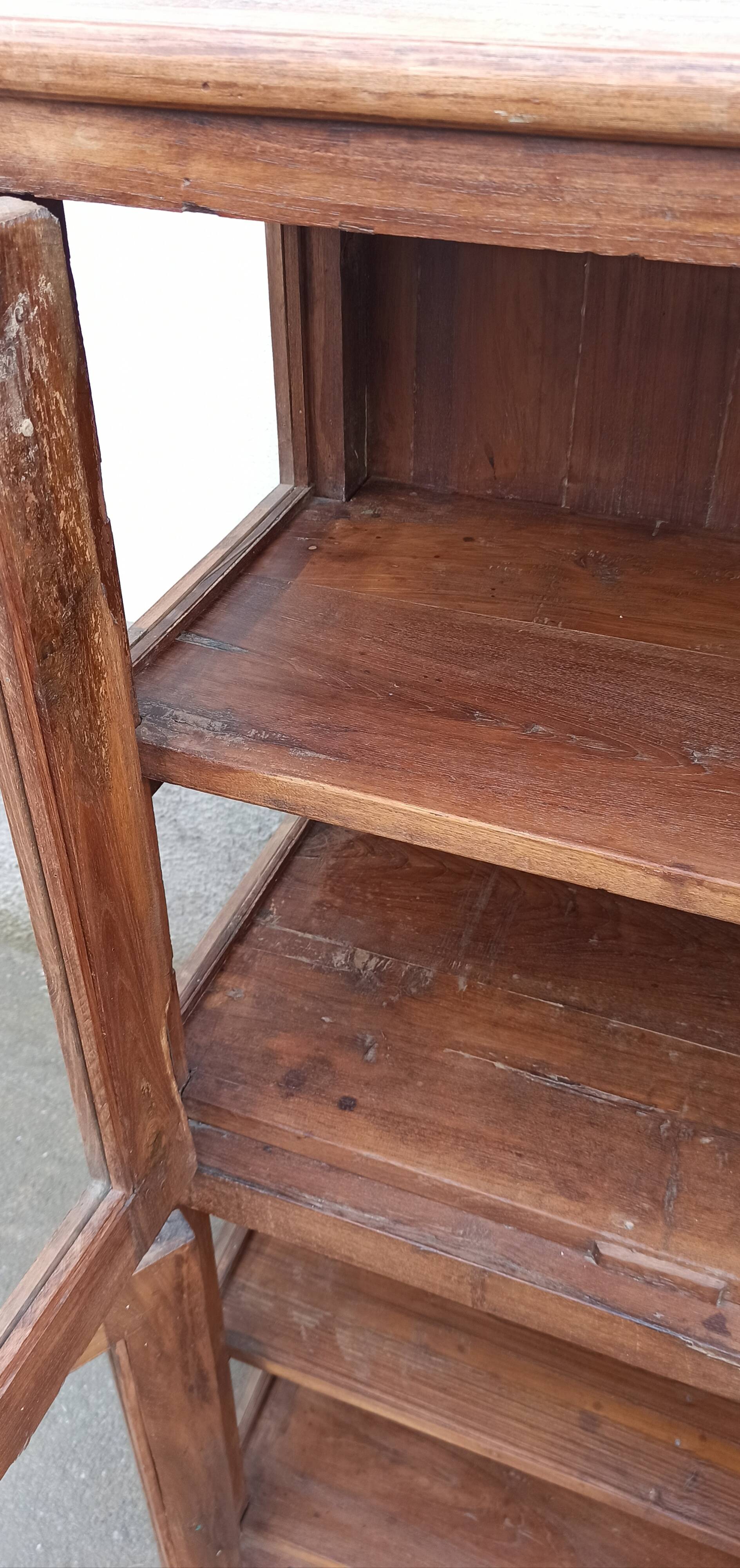 Old wooden display cabinet with three glazed sides