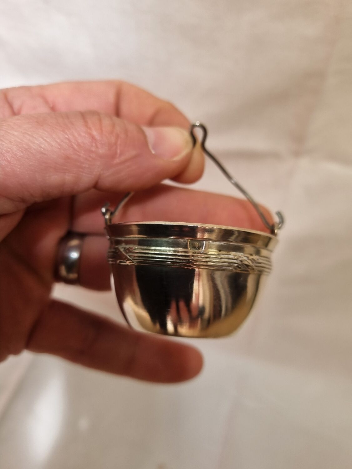 Tea strainer, solid silver, neck brace