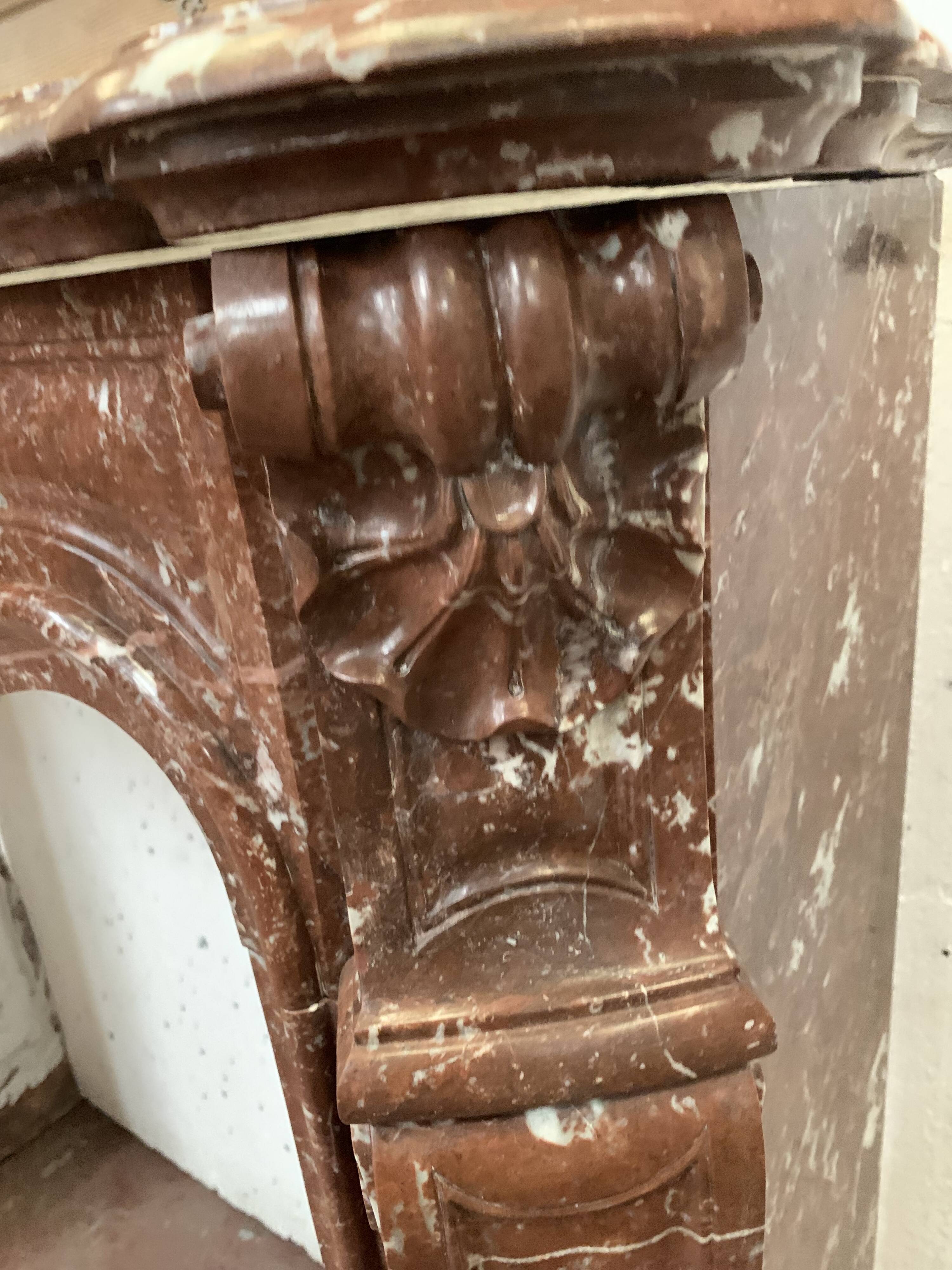 Fireplace three shells louis XV style in royal red marble XIX century