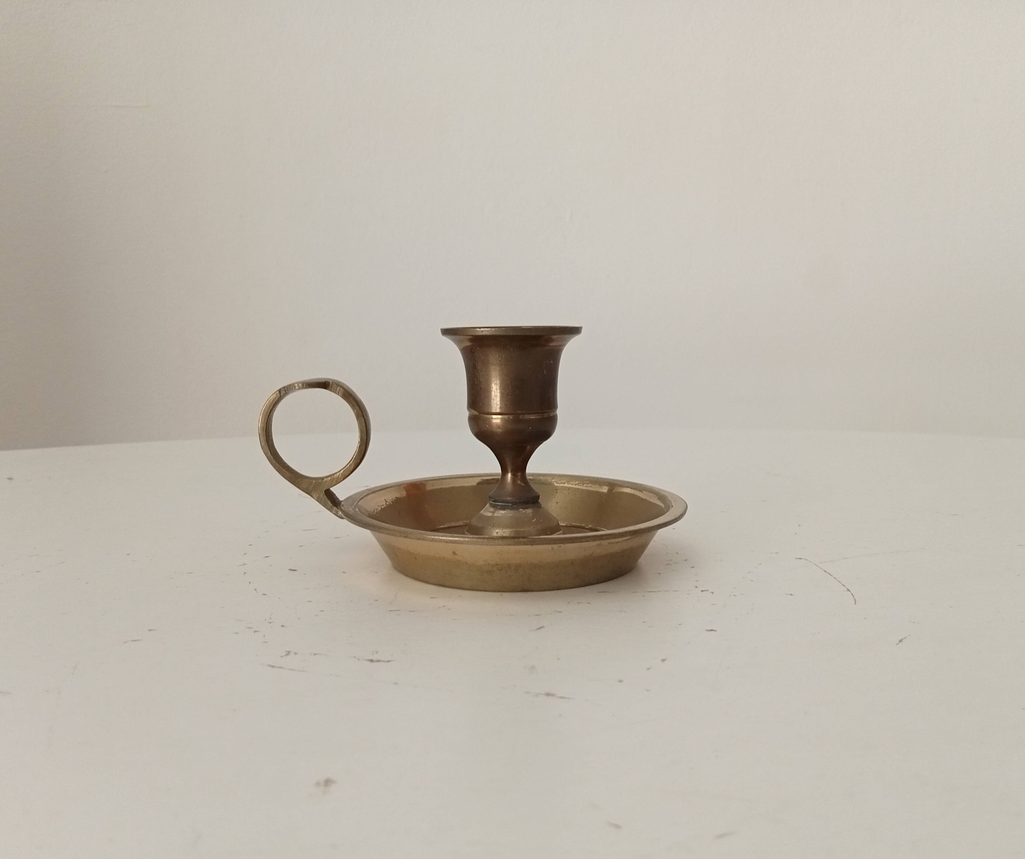 Vintage brass candle holder in gold.