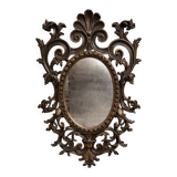 Antique Louis XV style mirror, richly carved with scrollwork, shells, and foliage.