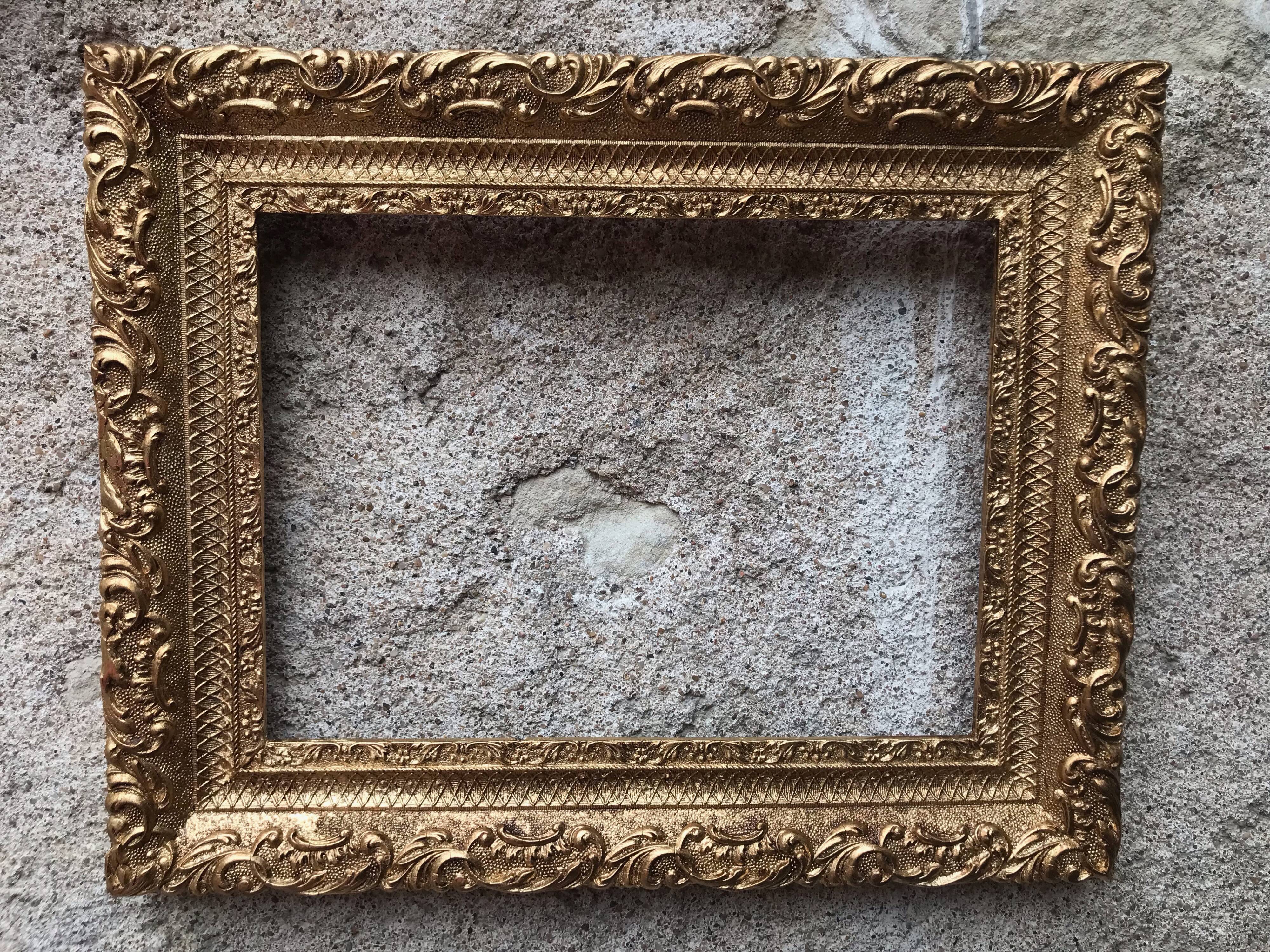 Old gilded frame with leaf